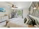 Stylishly decorated bedroom with patterned wallpaper, a window, and a comfortable bed at 3176 Duane Ave, Oldsmar, FL 34677