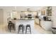 Open kitchen layout with stainless steel appliances, granite countertops, and a breakfast bar at 3176 Duane Ave, Oldsmar, FL 34677