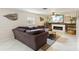 Cozy living room with a fireplace, mounted TV, and a large sectional sofa at 3176 Duane Ave, Oldsmar, FL 34677