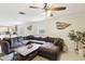 Comfortable living room with plush sectional sofa, ceiling fan, and stylish wall decor at 3176 Duane Ave, Oldsmar, FL 34677