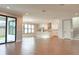 Spacious living area with wood-look tile floors, open floor plan and direct access to the kitchen at 3310 W Rogers Ave, Tampa, FL 33611