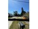 Cleared vacant lot ready for construction, with mature trees and a sunny, open space at 3310 W Rogers Ave, Tampa, FL 33611