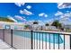 Black fenced pool area with clear blue water at Zephyr Shores at 35128 Dale Ave, Zephyrhills, FL 33541