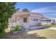 Well-maintained home with colorful shutters and covered entrance, framed by beautiful landscaping at 35128 Dale Ave, Zephyrhills, FL 33541
