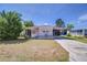 Charming single-story home with a covered carport, well-maintained lawn, and mature trees at 35128 Dale Ave, Zephyrhills, FL 33541