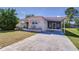 Well-kept single-story home with a carport and covered patio, set on a spacious lot at 35128 Dale Ave, Zephyrhills, FL 33541