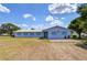 Exterior of the Zephyr Shores office featuring handicap parking, updated paint and well-maintained landscaping at 35128 Dale Ave, Zephyrhills, FL 33541