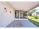 Spacious screened porch ideal for relaxing, furnished with seating and featuring a ceiling fan for added comfort at 35128 Dale Ave, Zephyrhills, FL 33541