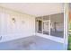 Spacious screened porch ideal for relaxing, furnished with seating and featuring a ceiling fan for added comfort at 35128 Dale Ave, Zephyrhills, FL 33541