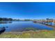 Zephyr Shores tranquil waterfront view with lake and boat dock access at 35128 Dale Ave, Zephyrhills, FL 33541