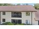 Exterior shot highlighting a private balcony and screened lanai area, perfect for outdoor relaxation at 3600 Magnolia Ridge Cir # 1221-G, Palm Harbor, FL 34684