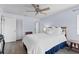 Inviting bedroom with wood floors, ceiling fan, natural light, and ample closet space at 3600 Magnolia Ridge Cir # 1221-G, Palm Harbor, FL 34684