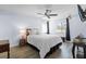 Comfortable bedroom features hardwood floors, ceiling fan, bright windows, and modern furniture at 3600 Magnolia Ridge Cir # 1221-G, Palm Harbor, FL 34684