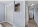 Primary bedroom features a closet and adjacent bathroom and hallway at 3600 Magnolia Ridge Cir # 1221-G, Palm Harbor, FL 34684