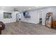 Bright, open-plan living space boasts wood flooring, contemporary decor, and seamless flow at 3600 Magnolia Ridge Cir # 1221-G, Palm Harbor, FL 34684