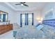 Spacious bedroom featuring a tray ceiling, large windows and a comfortable seating area at 3765 Maxwell Park Dr, Sun City Center, FL 33573