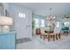 Welcoming entryway with elegant dining area, showcasing stylish furniture and ample natural light at 3765 Maxwell Park Dr, Sun City Center, FL 33573