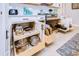 Kitchen featuring pull-out shelving in the cabinets for optimized storage of cookware and bakeware at 3765 Maxwell Park Dr, Sun City Center, FL 33573