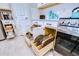 Well-organized kitchen cabinets with pull-out drawers maximize storage space for cookware and kitchen accessories at 3765 Maxwell Park Dr, Sun City Center, FL 33573