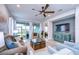 Comfortable living room with ample seating and a large sliding glass door with outdoor views at 3765 Maxwell Park Dr, Sun City Center, FL 33573