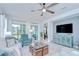 Comfortable living room with light blue walls, modern furniture and lots of natural light at 3765 Maxwell Park Dr, Sun City Center, FL 33573