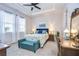 Bedroom with a ceiling fan and a window with natural light at 3765 Maxwell Park Dr, Sun City Center, FL 33573