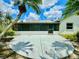 Backyard with patio and landscaping including a palm tree at 3944 102Nd N Pl, Clearwater, FL 33762