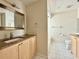 Well-lit bathroom with a granite countertop vanity and tile flooring at 3944 102Nd N Pl, Clearwater, FL 33762