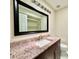 Bathroom with granite countertop and modern vanity mirror at 3944 102Nd N Pl, Clearwater, FL 33762
