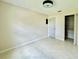 This bedroom features tile floors, a closet with organizers, and neutral paint at 3944 102Nd N Pl, Clearwater, FL 33762