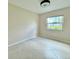 This bedroom features tile floors, a window, and neutral paint at 3944 102Nd N Pl, Clearwater, FL 33762