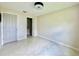 This bedroom features tile floors, a closet with organizers, and neutral paint at 3944 102Nd N Pl, Clearwater, FL 33762