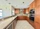 Bright kitchen with stainless steel appliances and sleek granite countertops at 3944 102Nd N Pl, Clearwater, FL 33762