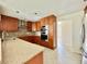 Modern kitchen featuring stainless steel appliances, granite countertops, and mosaic tile backsplash at 3944 102Nd N Pl, Clearwater, FL 33762