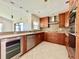 Open kitchen design with stainless steel appliances, granite countertops, and tile backsplash at 3944 102Nd N Pl, Clearwater, FL 33762
