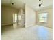 Bright living room with neutral walls, a ceiling fan, tile flooring and natural light with vaulted ceiling at 3944 102Nd N Pl, Clearwater, FL 33762