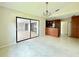 Spacious living room with tile floors and open layout to kitchen at 3944 102Nd N Pl, Clearwater, FL 33762