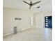 Bright living room features tile floors, ceiling fan and view of the front door with natural light at 3944 102Nd N Pl, Clearwater, FL 33762