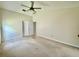 Main bedroom featuring neutral walls, vaulted ceiling, ceiling fan and double door closet for storage at 3944 102Nd N Pl, Clearwater, FL 33762