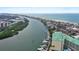 Scenic aerial view featuring a condo building alongside waterfront, showcasing coastal charm at 399 C 2Nd St # 313, Indian Rocks Beach, FL 33785
