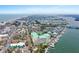 Aerial shot showcasing the condo building, marina, and the gulf in the background at 399 C 2Nd St # 313, Indian Rocks Beach, FL 33785