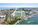 Aerial shot of waterfront condos with docking facilities, showcasing coastal living at 399 C 2Nd St # 313, Indian Rocks Beach, FL 33785