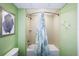 Bright bathroom with a shower-tub combo and tiled walls at 399 2Nd St # 313, Indian Rocks Beach, FL 33785