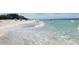 Scenic view of the beach with clear, aqua water and soft white sand, perfect for a relaxing day by the ocean at 399 C 2Nd St # 313, Indian Rocks Beach, FL 33785