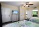 Charming bedroom with coastal decor, TV, and a convenient ensuite bathroom at 399 C 2Nd St # 313, Indian Rocks Beach, FL 33785