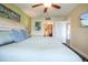 Serene bedroom with neutral colors, comfortable bed, and ensuite bathroom access at 399 C 2Nd St # 313, Indian Rocks Beach, FL 33785