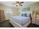 Cozy bedroom with a comfortable king-size bed and bright, inviting decor at 399 C 2Nd St # 313, Indian Rocks Beach, FL 33785