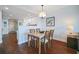 Cozy dining area with modern lighting, stylish table setting and adjacent kitchen view at 399 C 2Nd St # 313, Indian Rocks Beach, FL 33785