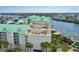 Multi-story building with water views and outdoor seating on multiple floors at 399 2Nd St # 313, Indian Rocks Beach, FL 33785
