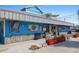 Exterior view of a blue seafood restaurant with nautical decor and patio seating at 399 2Nd St # 313, Indian Rocks Beach, FL 33785